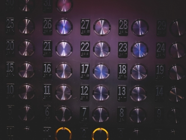 You end up sharing the elevator with an acquaintance. How do you respond?