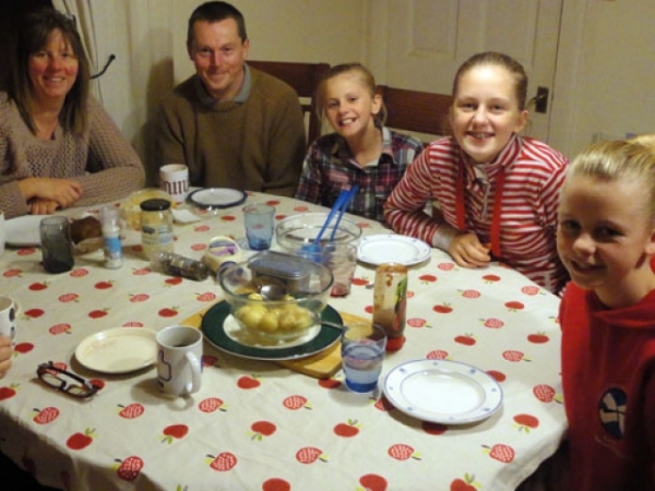 You're at a family dinner when your phone vibrates. The Caller ID shows that it's your boss. What do you do?