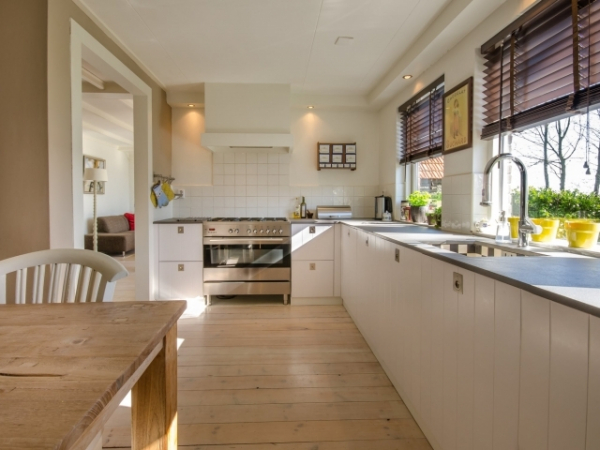 Your host tells you to sit and relax after dinner rather than helping. What do you do?