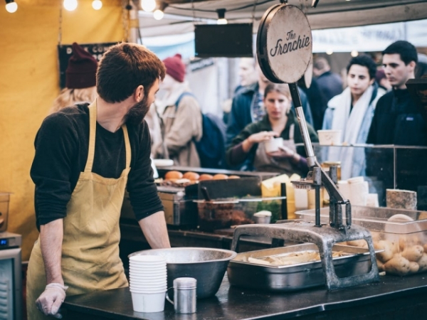You're waiting in a long line for the deli. What are you doing?