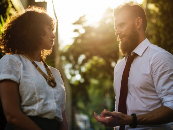 When talking to a member of the opposite sex, how do you stand?