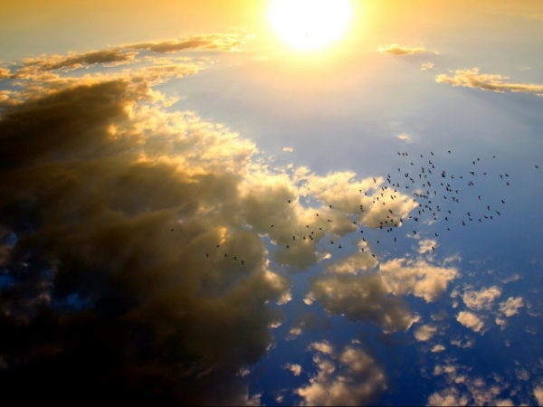 Which is hotter, the center of the earth or surface of the sun?