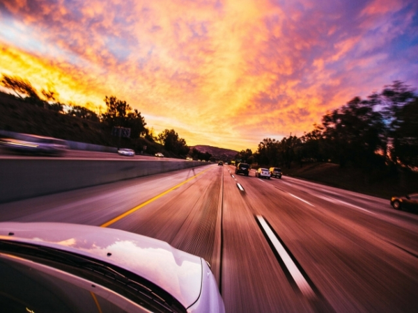 While driving, you notice the road start to shake. What do you do?