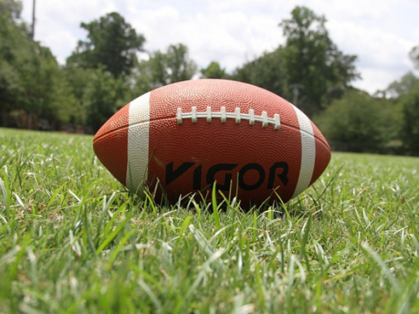A football game is going on. Where are you?