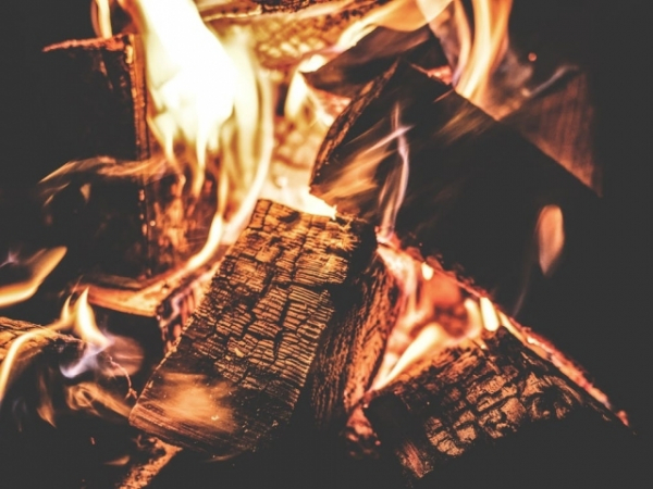 You're having trouble starting a fire, what's a helpful way to spark a flame?
