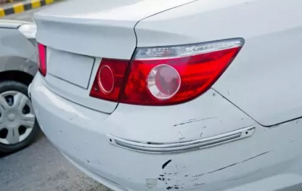 You borrow your parent's car and accidentally back into another car in the parking lot. You