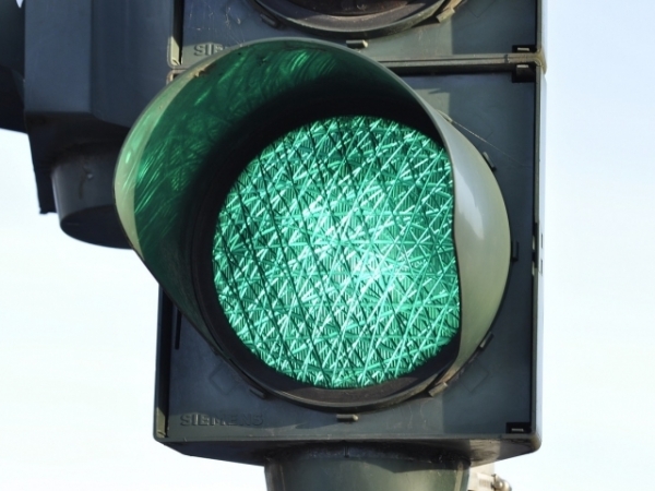The traffic light turns yellow as you approach. What do you do?