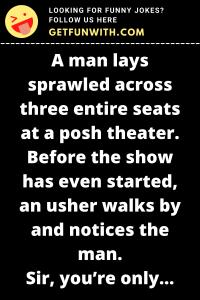 A man lays sprawled across three entire seats at a posh theater. Before the show has even started, an usher walks by and notices the man.
